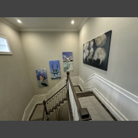 large photo art of manatees anfd fish above stairs