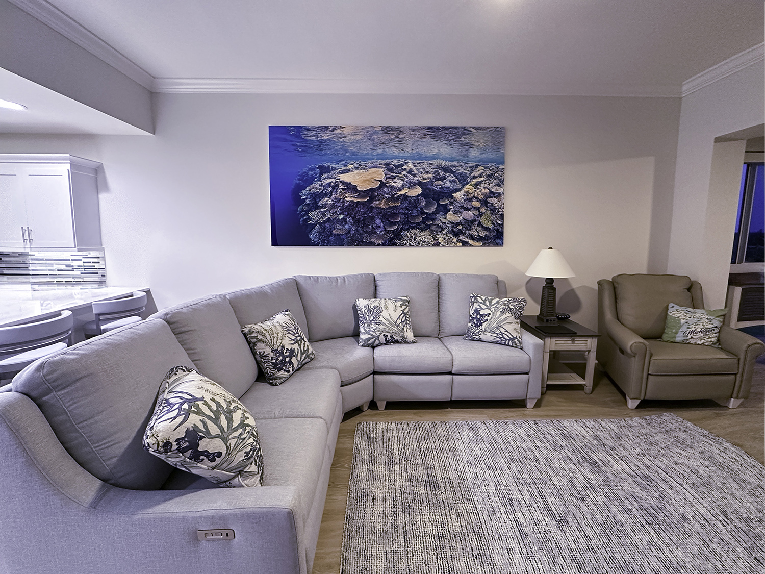 a large photo of a coral reef hanging above a coral reef