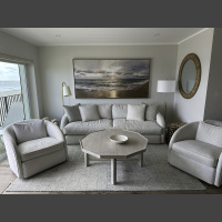 large beach sunrise photo hanging over a couch