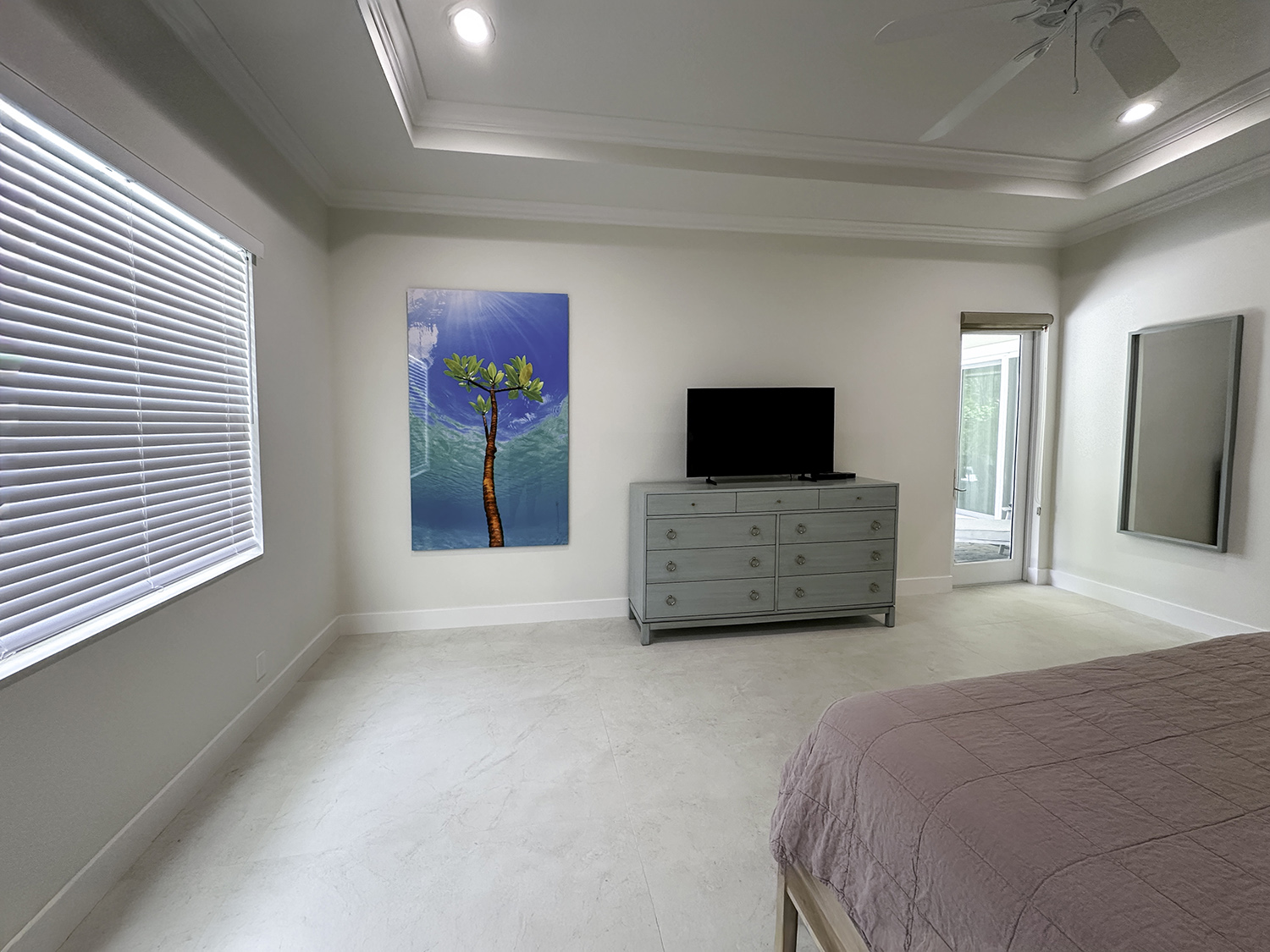large underwater photograph of a single mangrove tree on a wall in a bedroom