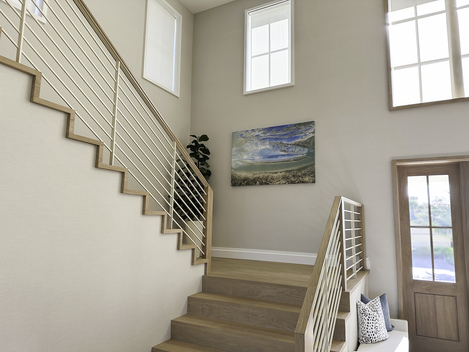 a large art underwater photograph of a wave from underneath, displayed on a staircase