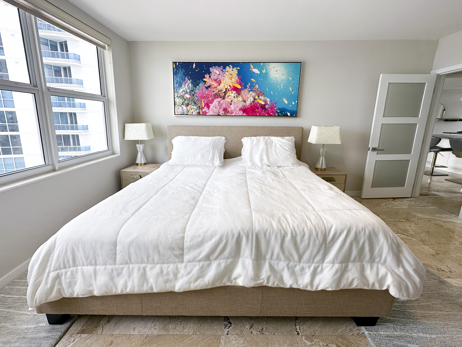 Rainbow Reef 75x25 Horizontal Canvas with Silver Frame Over King Bed